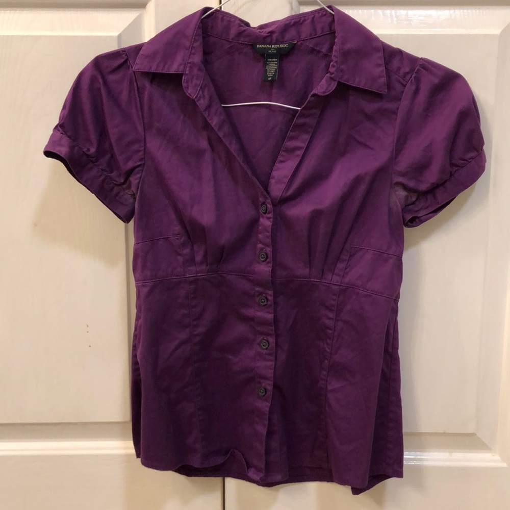 Woman’s purple button down blouse